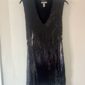 Fun, festive, black, sequin mini-dress. Perfect for a fun night out!